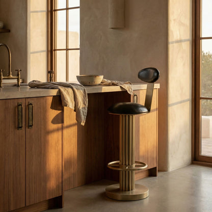 Noir Sedes Bar Stool Antique Brass, Black styled in an interior setting