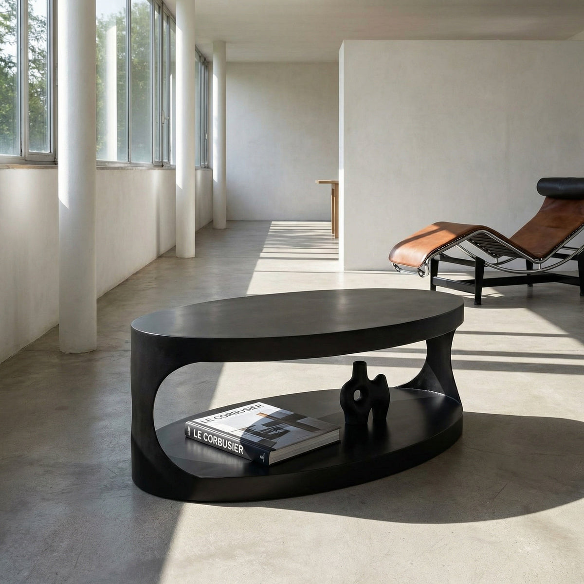 Noir Eclipse Oval Coffee Table Matte Black styled in an interior setting
