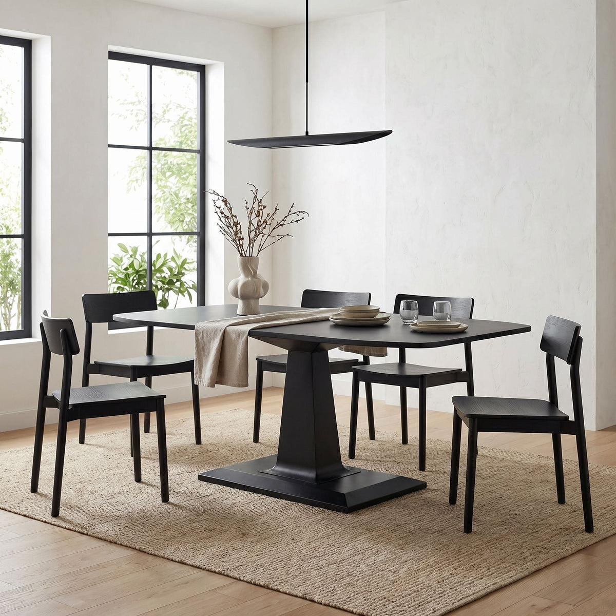 Noir Amboss Dining Table Matte Black styled in an interior setting
