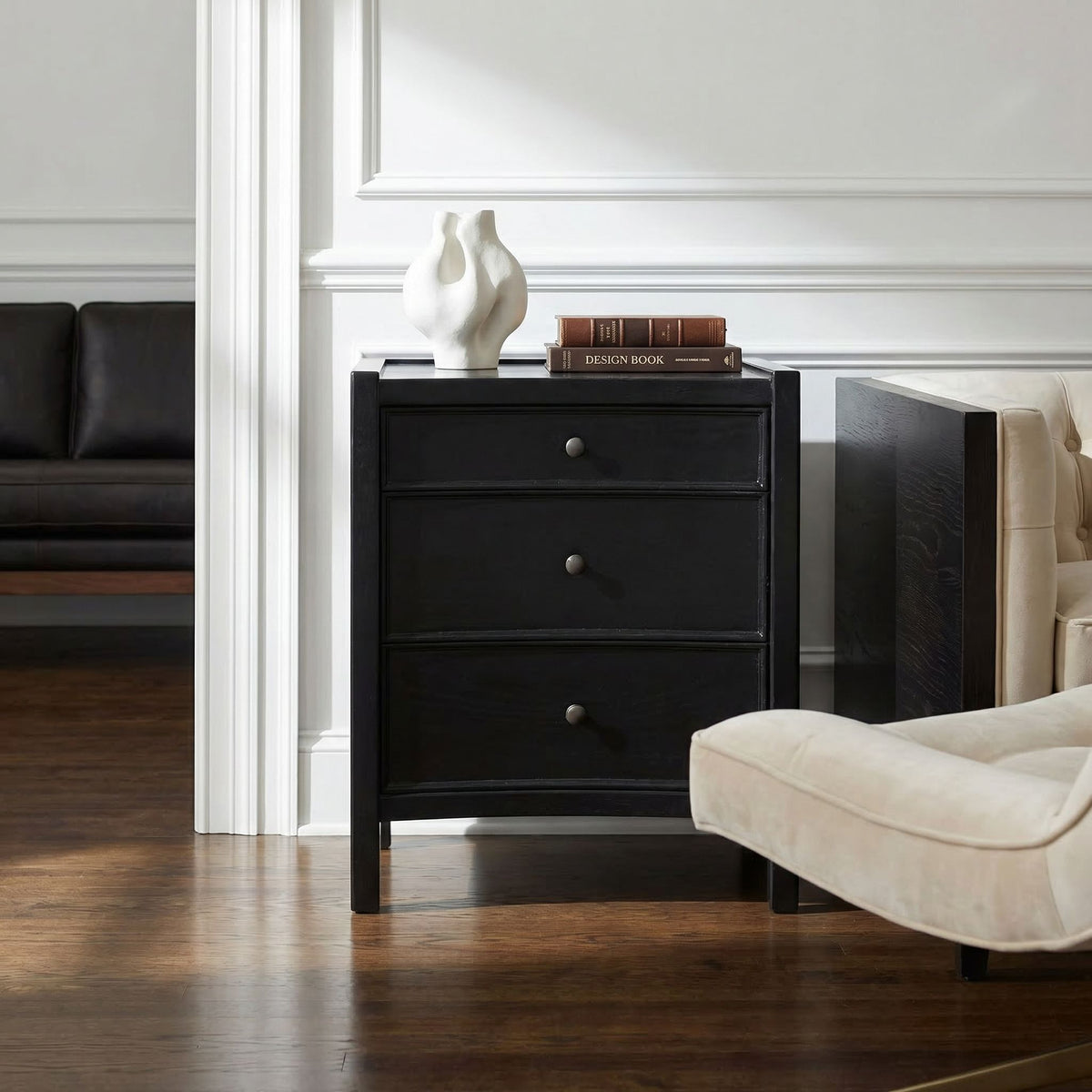 Noir Hampton Night Stand Hand-Rubbed Black styled in an interior setting