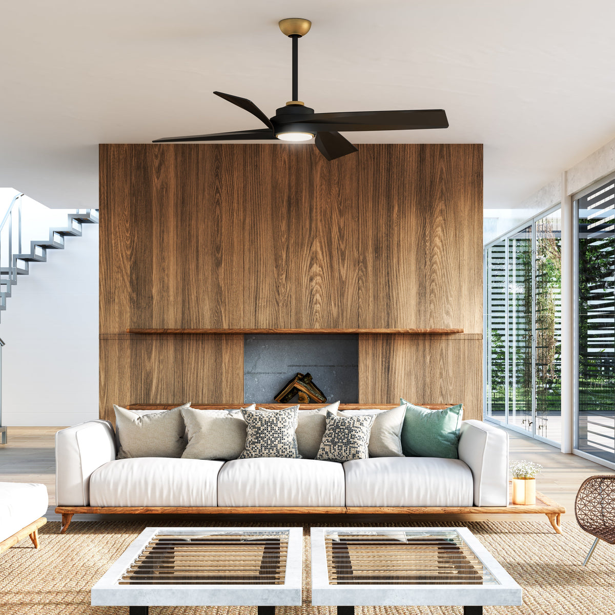 Modern living room with a white sofa, coffee table, wooden accent wall and black ceiling fan.