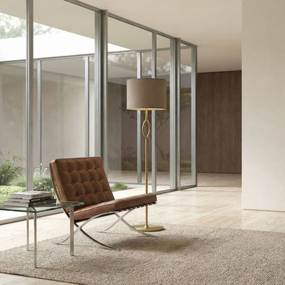 Noir Ridge Floor Lamp Antique Brass styled in an interior setting