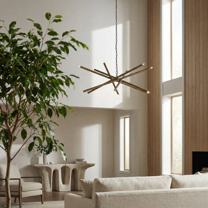 Noir Ikram Chandelier 10-Light Antique Brass styled in an interior setting