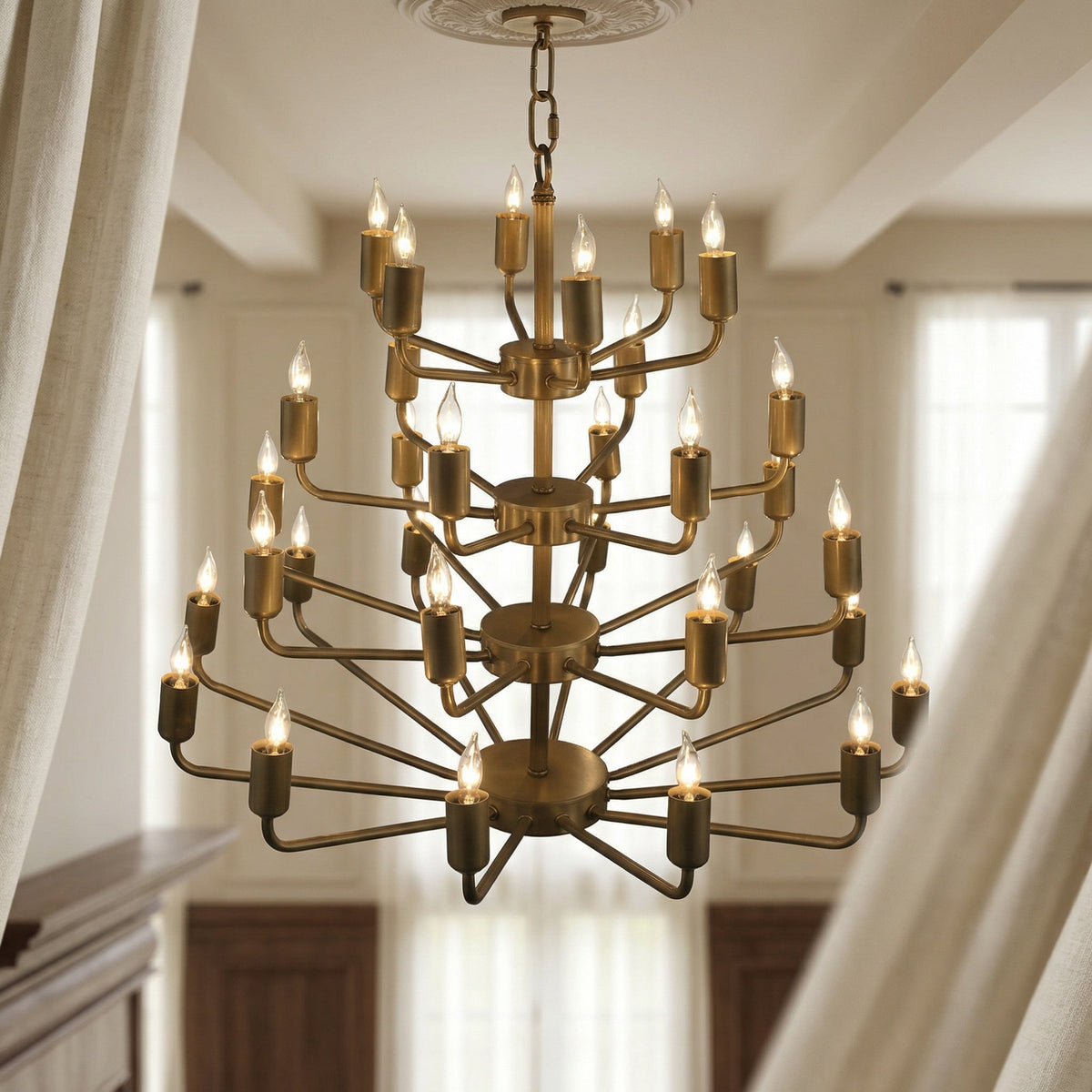 Noir Montoro Chandelier Antique Brass styled in an interior setting
