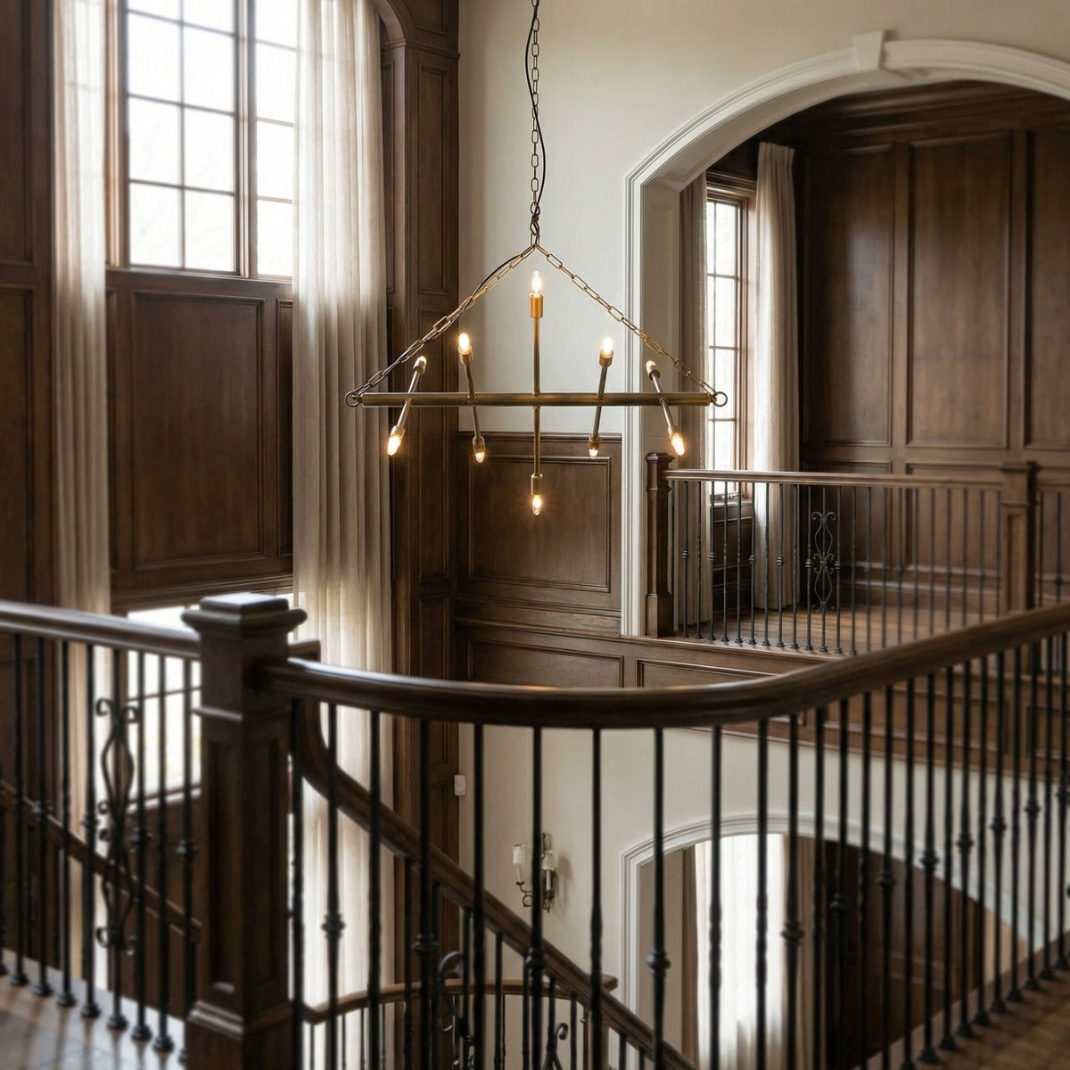 Noir Sperato Chandelier Antique Brass styled in an interior setting