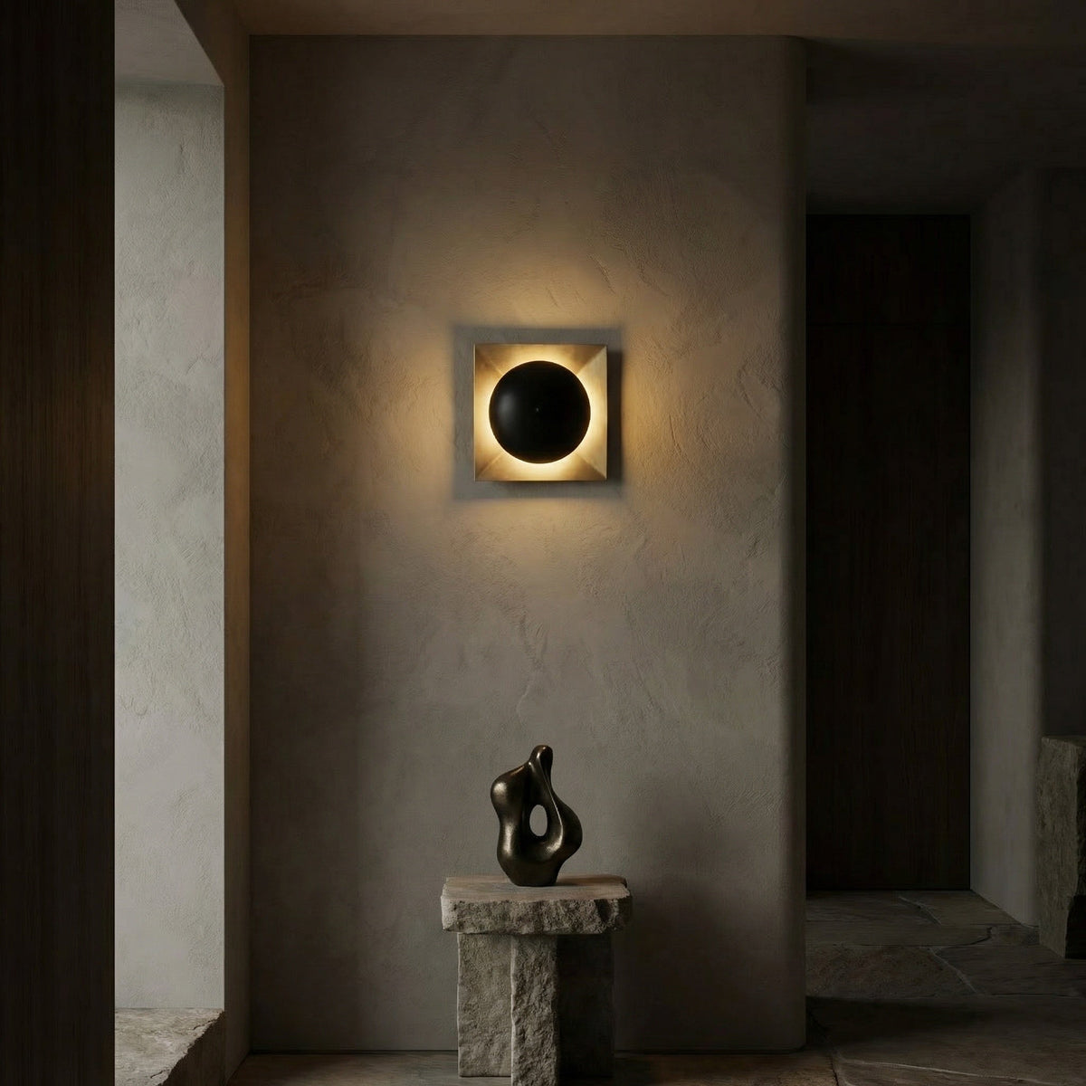 Noir Agila Wall Sconce Matte Black, Antique Brass styled in an interior setting