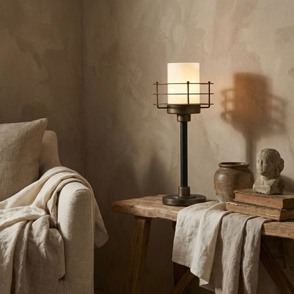 Noir Lighthouse Lamp Matte Black with Antique Brass Accents styled in an interior setting