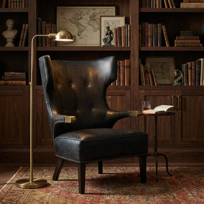 Noir Heracles Lounge Chair Antique Brass, Black styled in an interior setting
