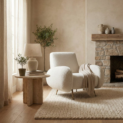 Noir Hera Lounge Chair Antique Brass, Off-White styled in an interior setting