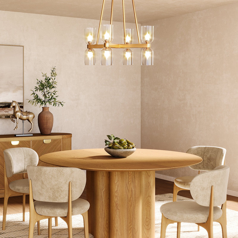 Dining room with a round wooden table, chairs, and a gold chandelier.