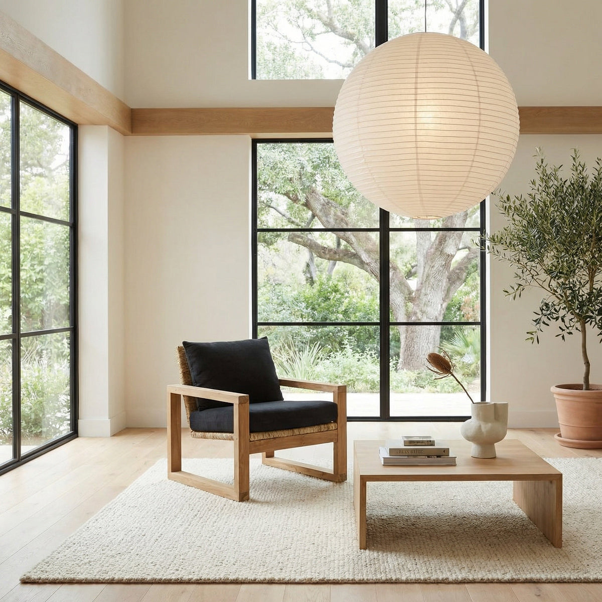 Noir Martin Armchair Natural, Black styled in an interior setting