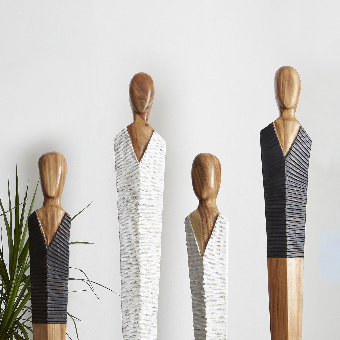 Vested Figure Sculpture