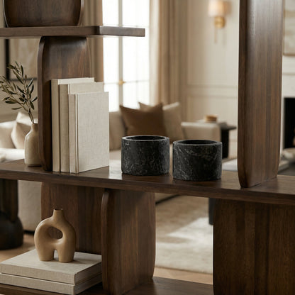Noir Syma Decorative Candle Holder Waxed Black styled in an interior setting