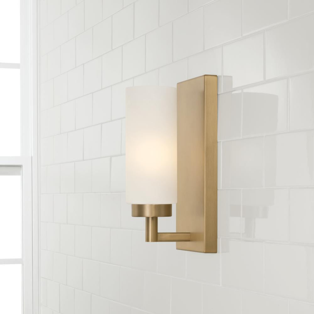 Capital 1-Light Cylindrical Sconce in Aged Brass with Faux Alabaster Glass