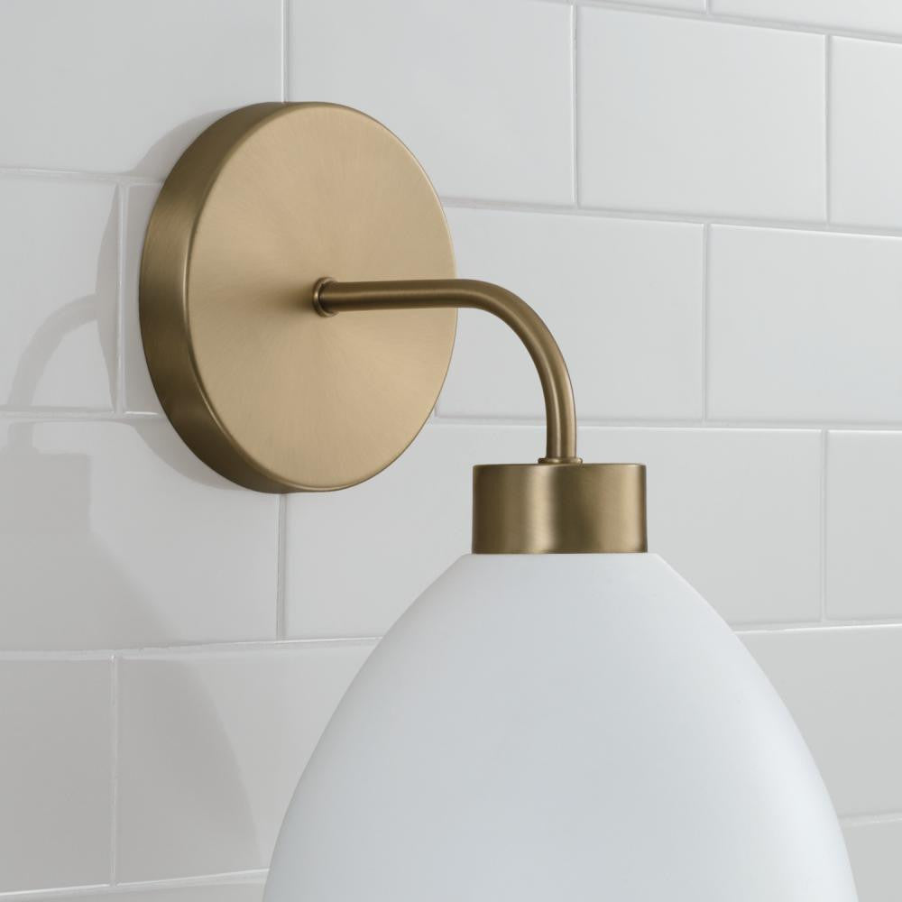Capital 1-Light Sconce in Aged Brass and White