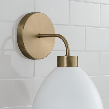 Capital 1-Light Sconce in Aged Brass and White