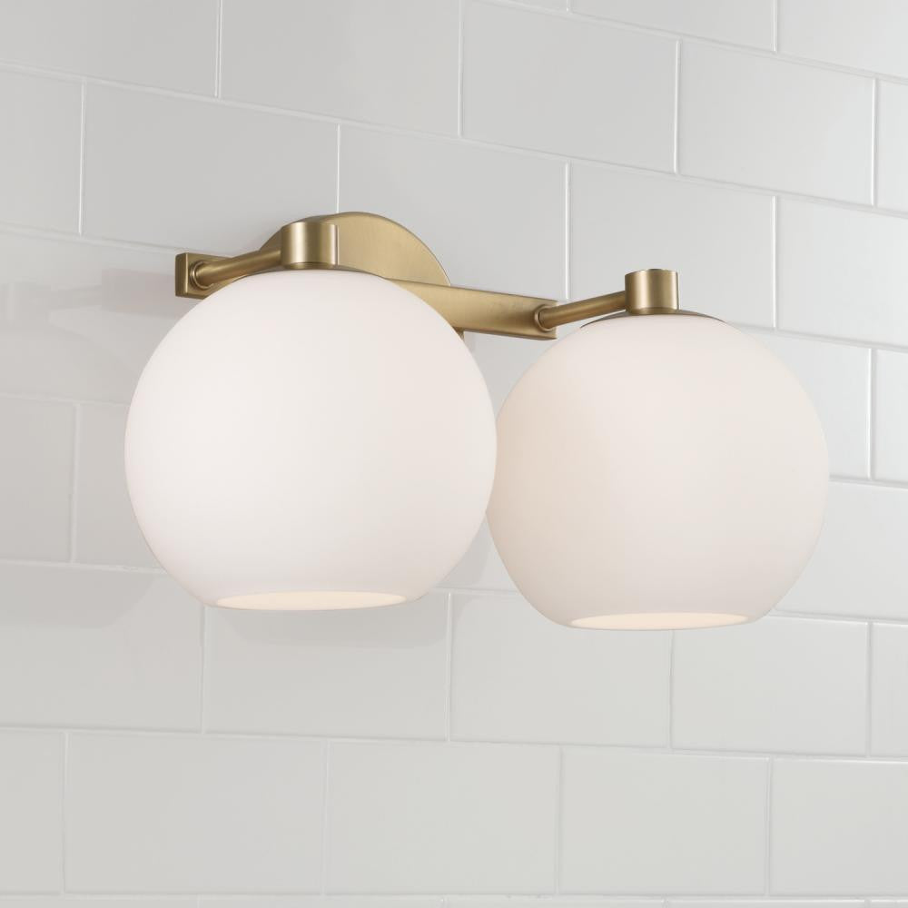 Capital 2-Light Circular Globe Vanity in Aged Brass with Soft White Glass