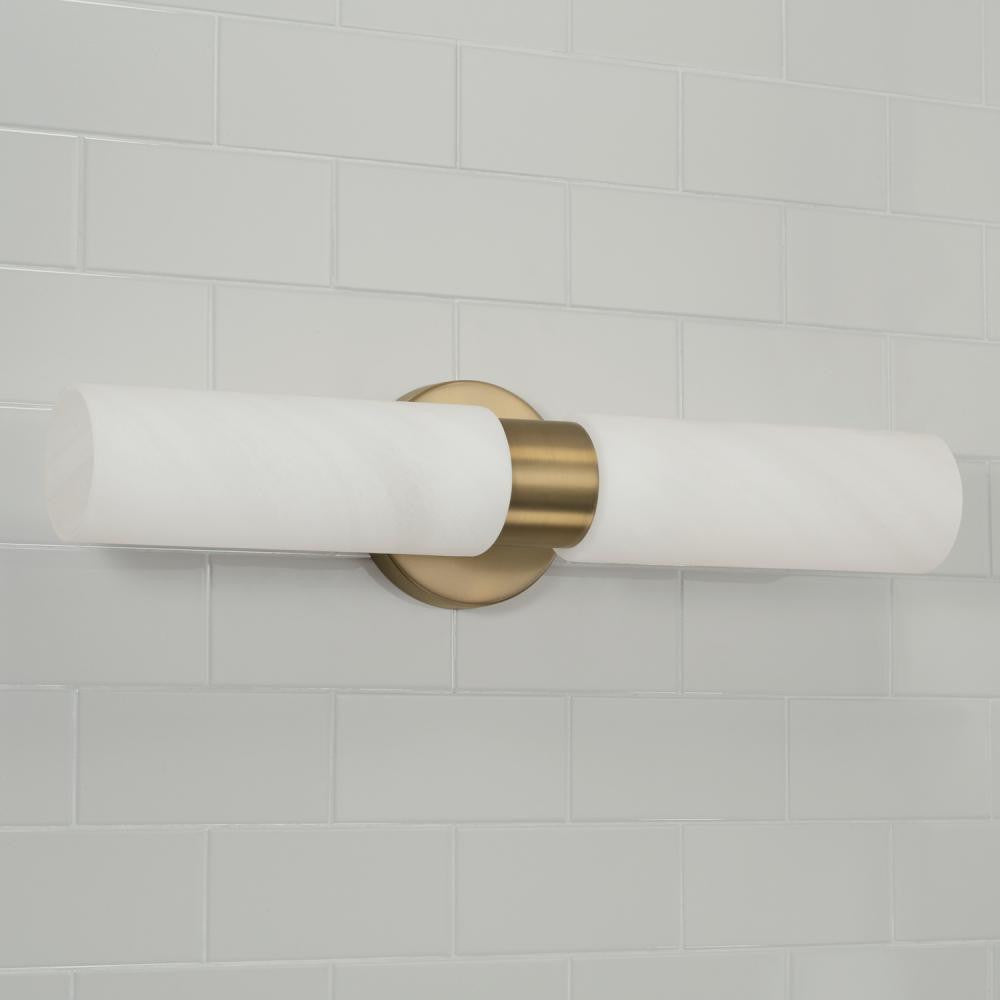 Capital 2-Light Cylindrical Linear Bath Bar Sconce in Aged Brass with Faux Alabaster Glass