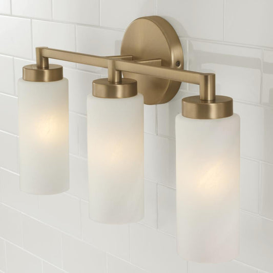 Capital 3-Light Cylindrical Vanity in Aged Brass with Faux Alabaster Glass