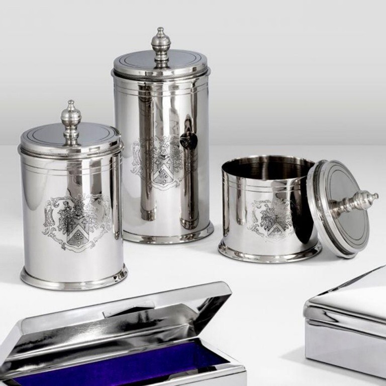 A group of silver containers